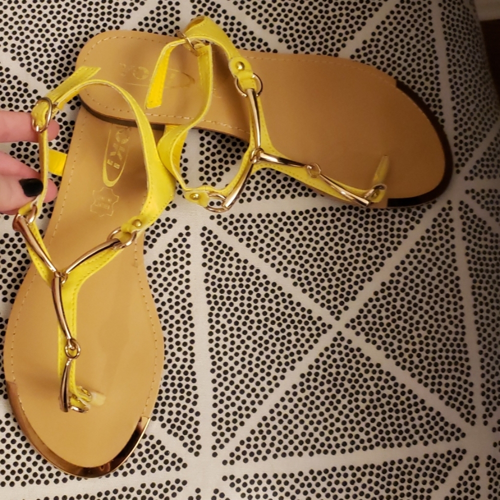 Yellow sandals with gold accents